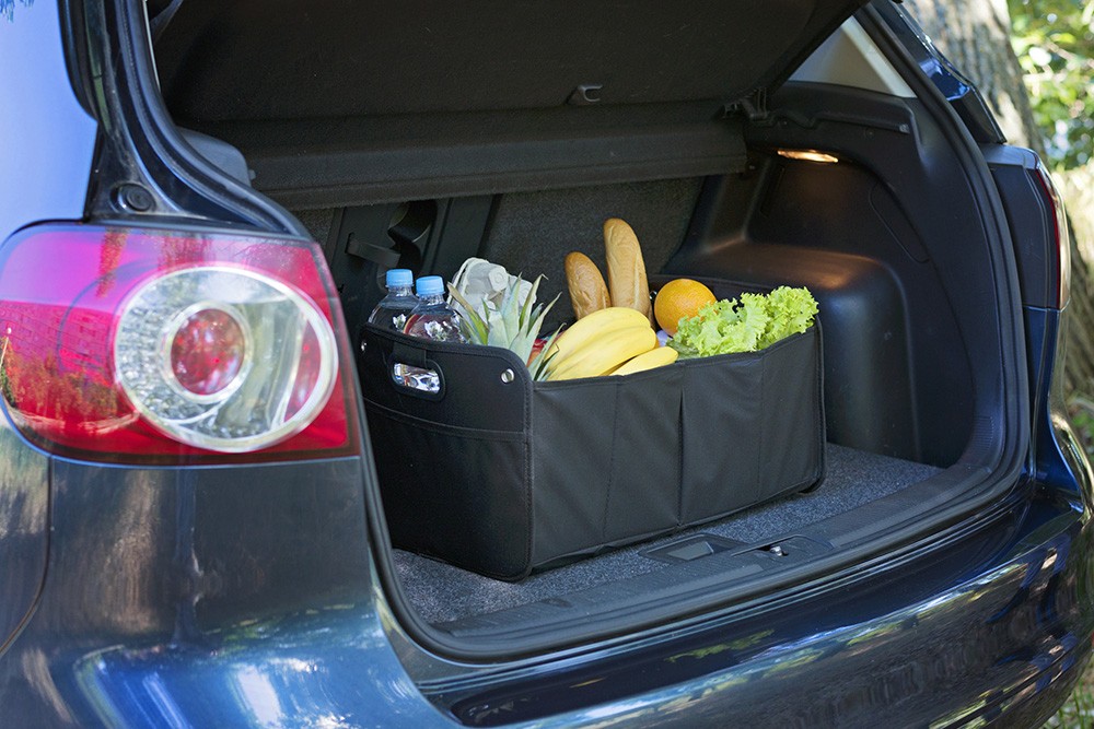 Simple organization keeps everything in place Grocery storage in trunk. Photo ID 118189846 © Irina Shpiller | Dreamstime.com