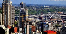 Mount Rainer peaking out above Seattle skyline. Mount Rainer beyond Seattle skyline. Photo ID 54948466 © Emilysfolio | Dreamstime.com